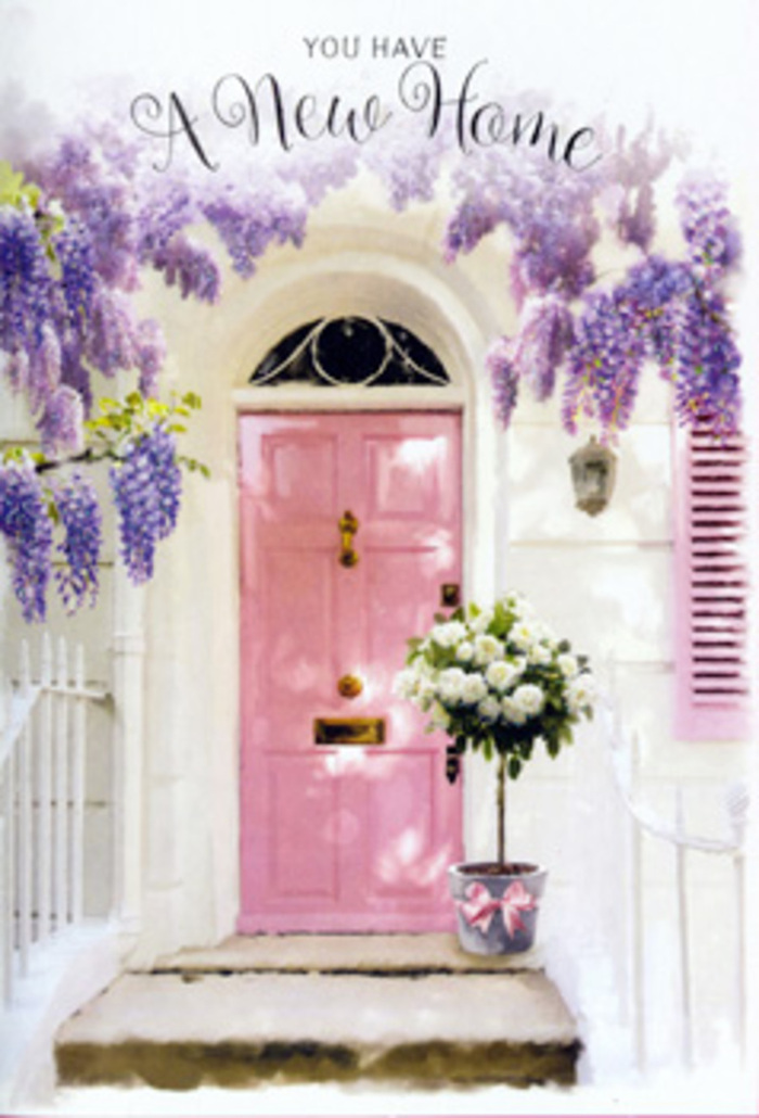 A welcoming Greenford doorway is captured here at a moment that feels suspended between anticipation and contentment, framed entirely by flowers and soft colour. The front door is painted a tender shade of pink, neither too bright nor too pale, with a slightly matte finish that absorbs the light and gives it a homely, lived-in charm, much like the prettiest façades along streets leading to Greenford Station. One side of the doorway is anchored by a single shutter in the same blush tone, its weathered edges adding character. Above and around the entrance, wisteria trails gracefully, its stems looping and dropping into thick strands of lilac and lavender blossoms. Each hanging cluster adds depth and a suggestion of movement, as if a gentle breeze from nearby Horsenden Hill might set them swaying. On the doorstep, acting as the focal point at ground level, is a hand-arranged bucket of flowers. Plush white and cream roses, some tinged with the faintest hint of ivory, are arranged in a generous, rounded mass. Tucked between them are sprigs of fresh green foliage, offering contrast and helping the composition feel as though it has been freshly gathered from a local garden. The blooms are cradled in a simple grey tin-style bucket, which has been dressed with a soft pink ribbon tied snugly around it, the bow mirroring the hue of the door and uniting the whole scene. The light is mellow and golden, glancing off the petals and catching on the leaves, creating a warm, late-afternoon glow. The overall impression is of a quiet housewarming moment in Greenford, flowers placed with care to greet the very first visitors and to whisper reassurance that this new home will be a place of comfort and gentle joy.